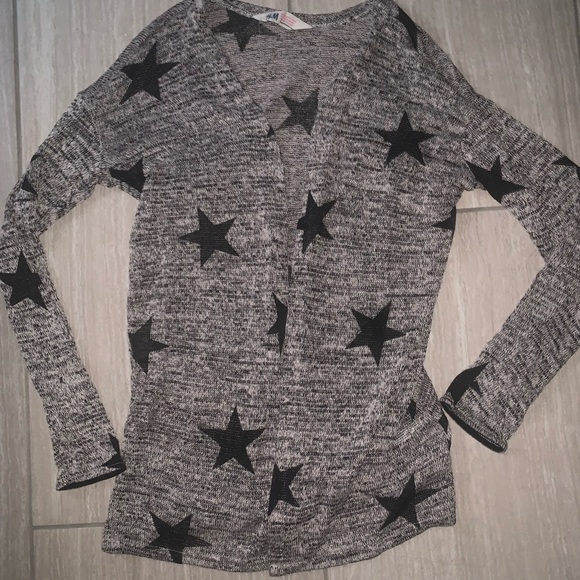 gray sweater with black stars